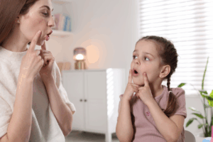 mother is teaching her child through learning activities